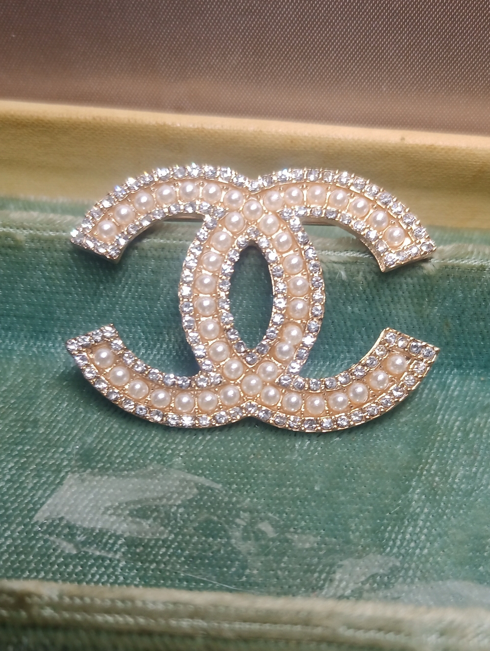 Gold-Tone Interlocking CC Brooch with Champagne Pearls and Clear Crystals